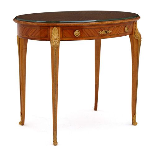 Ormolu mounted oval table retailed by Au Gros Chêne