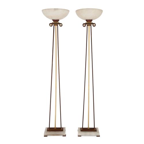 Pair of modern alabaster, gilt and patinated iron floor lamps