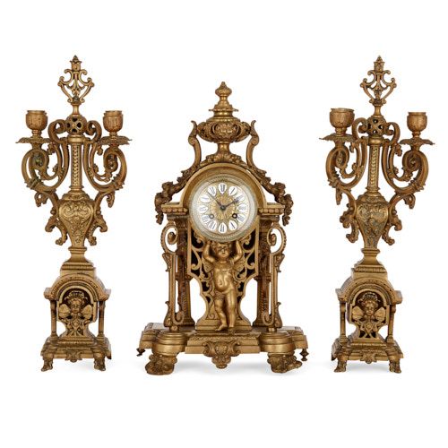 Antique French three-piece ormolu clock set