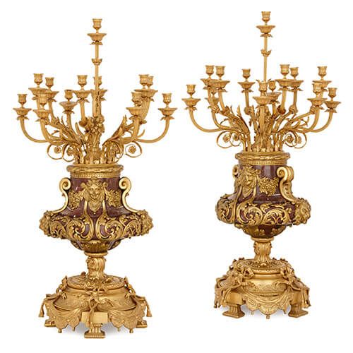 Pair of Louis XVI style ormolu and red marble candelabra