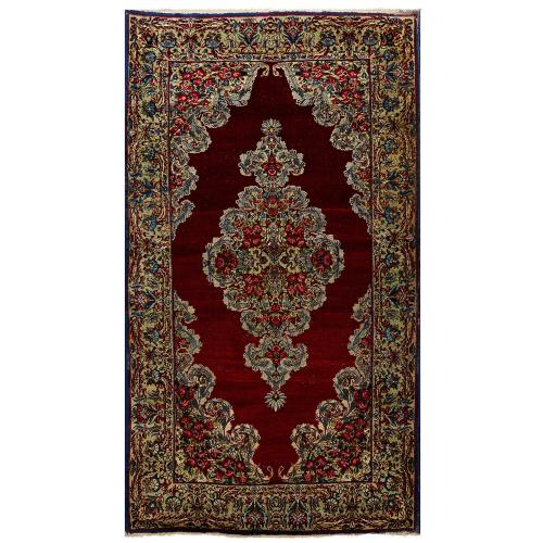 Antique Kirman woven wool Persian rug