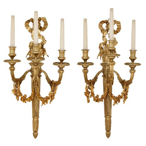 Pair of Louis XVI style ormolu three-light wall lights