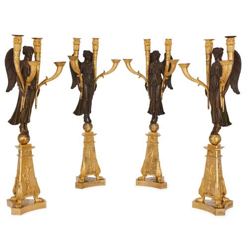 Four antique Empire period gilt and patinated bronze candelabra