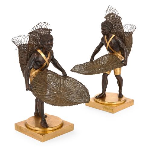 Pair of gilt and patinated bronze models of Nubian figures