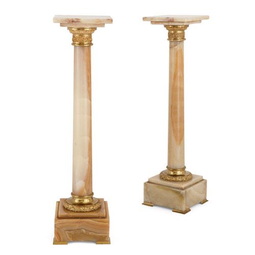 Pair of French ormolu mounted onyx column pedestals