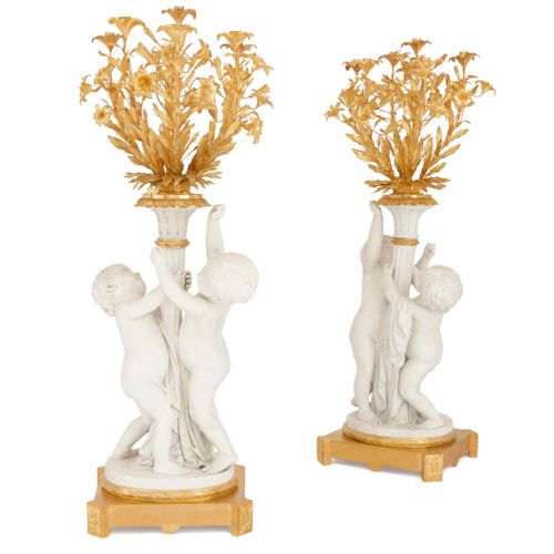 Pair of large figural bisque porcelain and ormolu candelabra