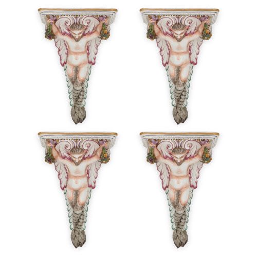 Set of four painted porcelain satyr form wall brackets