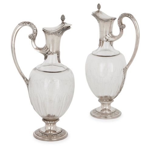 Pair of silver and crystal glass claret jugs by Devaux