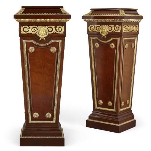 Pair of Louis XVI style mahogany and giltwood pedestals