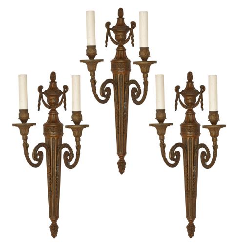 Set of three Neoclassical style patinated metal wall lights