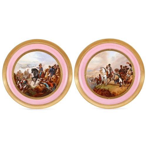 A pair of large Sevres style Napoleonic porcelain chargers
