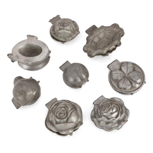 Collection of eight antique pewter ice-cream moulds