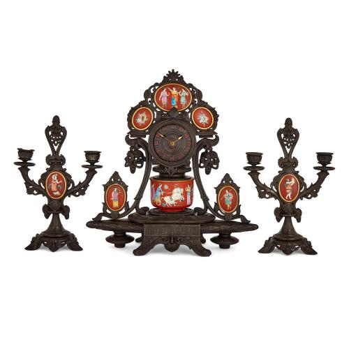 French porcelain and cast iron Neo-Grec three-piece clock set