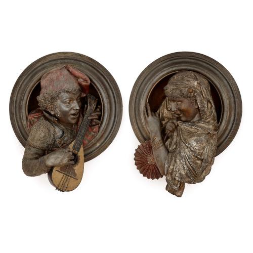 Pair of spelter Orientalist figurative wall plaques